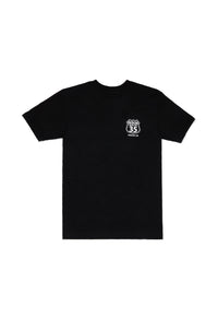 Black t-shirt with a small white logo on a white background