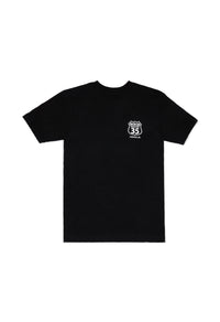 Black t-shirt with a small white logo on a white background