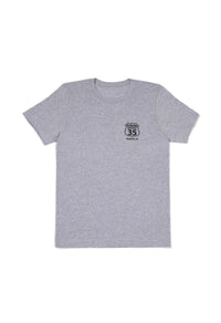 Gray t-shirt with a small logo on a white background